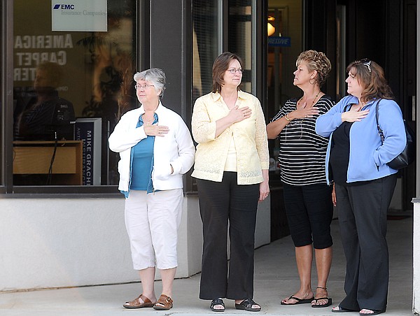 &lt;p&gt;By-standers stop and hold hands over hearts as a procession of
students, sfaff and family members from Saint Matthew's Catholic
Church make their way from the church to the Kalispell Fire
Department on Friday morning in Kalispell.&lt;/p&gt;