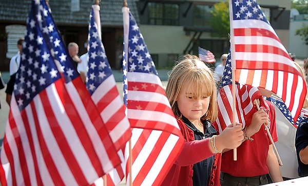 &lt;p&gt;Saint Matthew's first grader Fiona Coulter places a flag at the
memorial outside the Kalispell Fire Department on Friday morning.
Coulter and others from St. Matthew's carried flags from the church
to the fire department following the September 11th Ten-Year
Memorial mass.&lt;/p&gt;