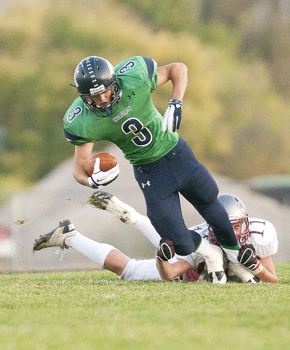 &lt;p&gt;Glacier wide receiver Kyle Griffith (3) tries to escape a tackle
by a Helena High defender during Friday&#146;s game at Legends
Stadium.&lt;/p&gt;