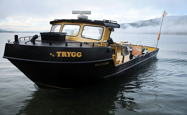 A netting crew of contractors as well as participants from several government agencies heads out onto the lake to bring in the morning catch at Swan Lake on Friday. The fish are being caught as part of a Lake Trout suppression project.