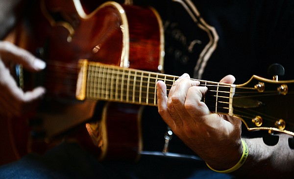 &lt;p&gt;Aaron Green plays a guitar he made in the main lodge at Flathead Lake Lodge on Wednesday. Green attended the guitar festival before and enjoyed the experience so much he came back this year as a sponsor.&lt;/p&gt;