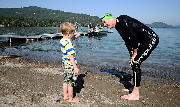 &lt;p&gt;Steve Pleasants of Whitefish, smiles and talks with his grandson Elijah, 3, after completing a swim of the length Whitefish Lake on Monday, August 26, at City Beach in Whitefish. Pleasants decided to swim from the north shore near Swift Creek to City Beach on his 60th birthday in order to raise funds for Operation Valor, a non-profit organization that helps wounded soldiers get the help they need to transition back to a normal life. (Brenda Ahearn/Daily Inter Lake)&lt;/p&gt;