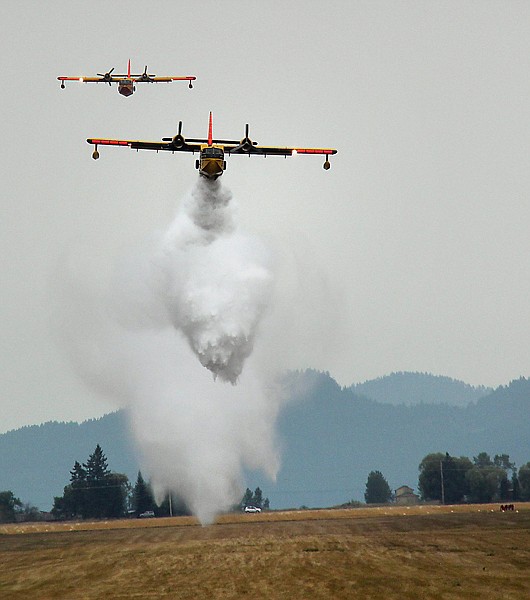 &lt;p&gt;A pair of CL-215 &#147;Super Scoopers&#148; from Alaska practice water drops Tuesday at the Sky Ranch Airfield south of Kalispell. The two planes, which were scooping up heavy payloads of water from Flathead Lake, have been staged at Glacier Park International Airport for the last couple of weeks to assist with any fires in the region if necessary. The extent of their stay at the airport will depend on when changing weather lowers the fire danger.&lt;/p&gt;