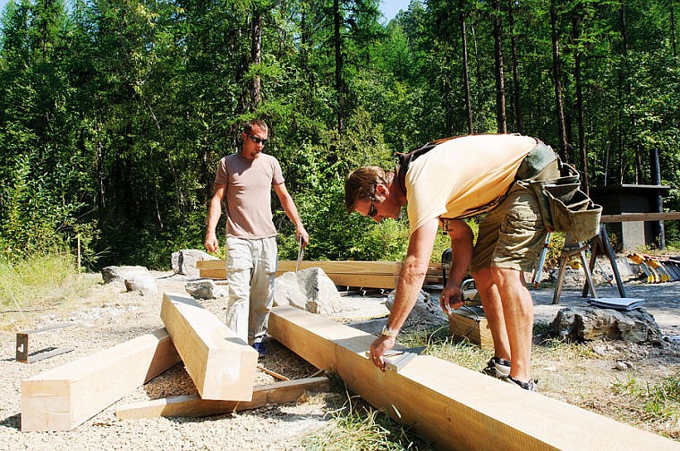 &lt;p&gt;Derrick Thompson of Thompson Design and Management, right, and Alex Harris build the kiosk for the new Woods Lake Trailhead Wednesday afternoon in the Whitefish Trails.. Sept. 4, 2013 in Whitefish, Montana. (Patrick Cote/Daily Inter Lake)&lt;/p&gt;