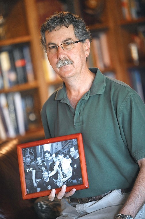 &lt;p&gt;Retired New York City Firefighter Kevin Shea, who lives near Kalispell, holds a photograph of group of fellow firefighters taken shortly after a 1991 rescue. Of the seven men, three died while responding the Sept. 11 terrorist attacks and two were badly injured in other fires. Shea, shown third from the left in the back row, survived the 1993 World Trade Center bombing and spent a month helping with the recovery effort after the Sept. 11, 2001 attacks.&lt;/p&gt;