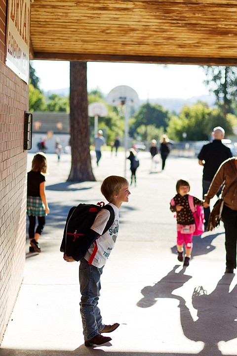 &lt;p&gt;SHAWN GUST/Press Riley Miller, a second grade student at Bryan Elementary, holds a pose during first day of school pictures by his mom prior to the start bell.&lt;/p&gt;