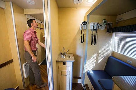 &lt;p&gt;Chris Meyer, with Parkwood Business Properties, the landlord for Legacy Health, checks out the company's new mobile health care vehicle.&lt;/p&gt;