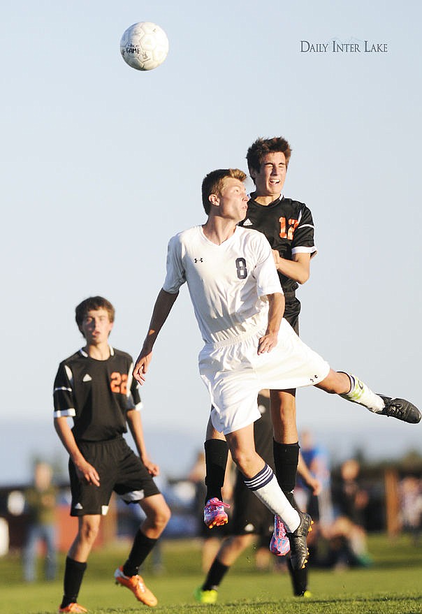 <p>Glacier's Kade Deleray is pushed in the back by Flathead's Carter Warnell as they go for a head ball during the second half of the Wolfpack's 1-0 victory at Glacier High School Thursday. (Aaric Bryan/Daily Inter Lake)</p>
