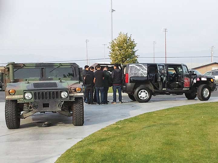 Wahluke High School students walk through a static display of Washington National Guard military vehicles at last year's Veterans Day Assembly. This year's assembly, open to the public, will be held at 10:30 a.m. on Nov. 9.
