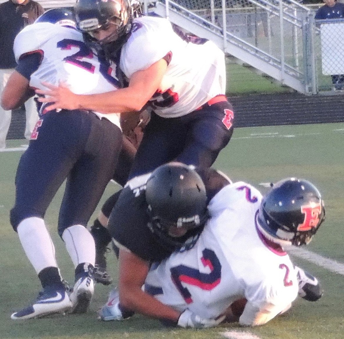 Ellensburg quarterback Bryce Helgeson is sacked by Ramses Gonzalez.