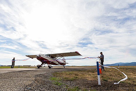 &lt;p&gt;The prop of a1973 M-4 Maule, driven by Gene Soper, cuts streamers as it taxies passed by during the ribbon-cutting.&lt;/p&gt;