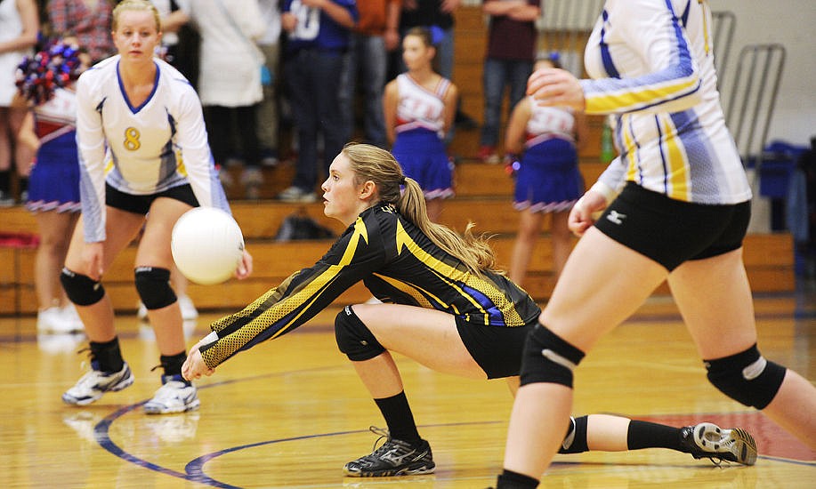 <p>Libby libero Mahalah Wedel digs out a serve against Columbia Falls on Thursday. (Aaric Bryan/Daily Inter Lake)</p>