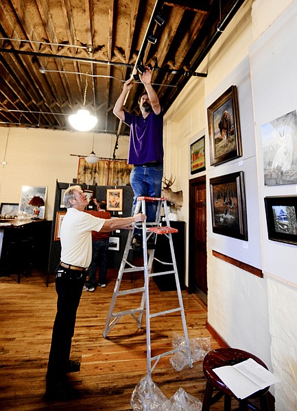 &lt;p&gt;Nicholas Oberling adjusts lights as he, Mark Ogle and others prepare for the Student/Teacher Art Show on Monday, September 9, at the Glacier Art Academy in the KM Building in Kalispell. (Brenda Ahearn/Daily Inter Lake)&lt;/p&gt;