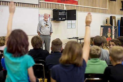 &lt;p&gt;Fifth-grade students raise their hands in hopes Coeur d&#146;Alene artist Mel McCuddin will answer their questions Tuesday during McCuddin&#146;s visit to Sorenson Magnet School of Arts &amp; Humanities in Coeur d&#146;Alene.&lt;/p&gt;