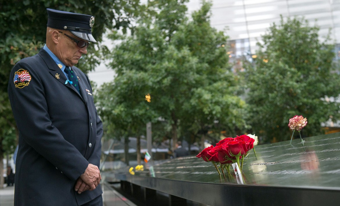 &lt;p&gt;Retired New York City firefighter Joseph McCormick visits the South Pool prior to a ceremony at the World Trade Center site in New York on Friday, Sept. 11, 2015. With a moment of silence and somber reading of names, victims' relatives began marking the 14th anniversary of Sept. 11 in a subdued gathering Friday at ground zero. (AP Photo/Bryan R. Smith)&lt;/p&gt;