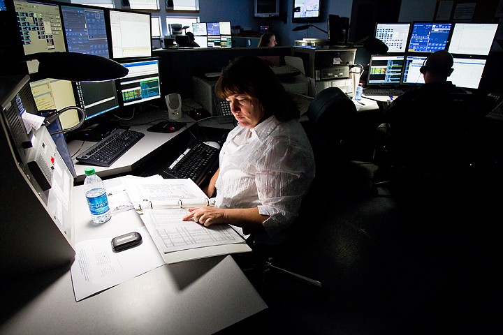 &lt;p&gt;Cheryl Hallgren, communications supervisor for the Kootenai County 9-1-1 Center, dispatches fire calls Friday during her shift. The county is restructuring salaries as a way to attract qualified dispatch employees.&lt;/p&gt;