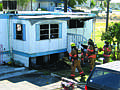 Mobile home catches fire in Moses Lake