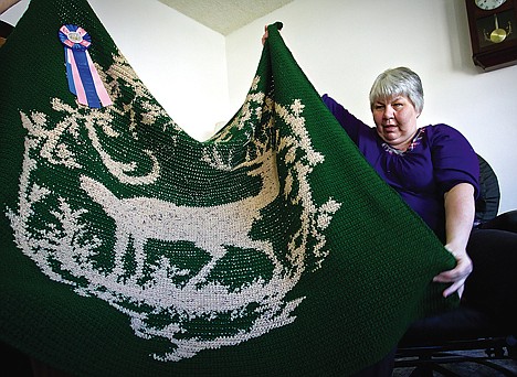 &lt;p&gt;DeLaine Mardell displays the award-winning afghan she created despite being totally blind. The Coeur d'Alene woman became totally blind about 15 years ago, yet has taken on a number of crochet and sewing projects.&lt;/p&gt;