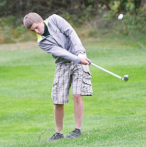 &lt;p&gt;Kyle McNew chips on the second hole at Meadow Lake golf course Tuesday.&lt;/p&gt;