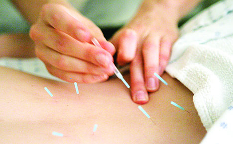 &lt;p&gt;FILE - In this Monday, Sept. 24, 2007 file photo, Anah McMahon, L. Ac. adjusts one inch seirin acupuncture needles in the muscles around the spine of a patient to relieve lower back pain, at the Pacific College of Oriental Medicine in Chicago. Acupuncture gets a thumbs-up for helping relieve pain from chronic headaches, backaches and arthritis in a review of more than two dozen studies - the latest analysis of an often-studied therapy that has as many fans as critics. The new analysis was published online Monday, Sept. 10, 2012 in Archives of Internal Medicine. (AP Photo/M. Spencer Green)&lt;/p&gt;