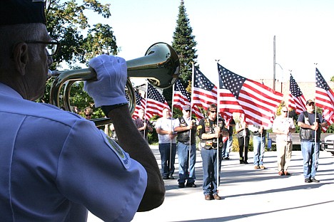 &lt;p&gt;Harold Markiewicz, left, of American Legion Post 143 in Post Falls, plays &Ograve;Taps&Oacute; on the bugle while members of the Patriot Guard Riders present the flags during Wednesday&Otilde;s 9-11 Day of Service and Remembrance Ceremony in Post Falls.&lt;/p&gt;