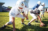 Parents fly in new football helmets from Bozeman