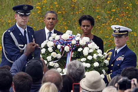 &lt;p&gt;President Barack Obama and first lady Michelle Obama lay a wreath at the Wall of Names at phase 1 of the permanent Flight 93 National Memorial near the crash site of Flight 93 in Shanksville, Pa., Sunday.&lt;/p&gt;