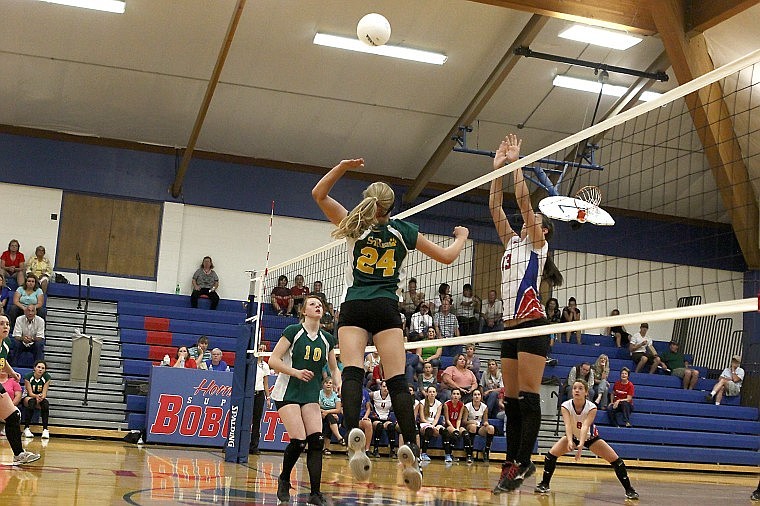 <p>Tiger freshman Pilar Cantrell-Field goes up for a spike with Superior's Myranda Kuhl defending</p>