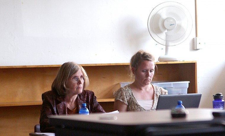 &lt;p&gt;Recently hired St. Regis Superintendent Janet Hanson (left) at the board meeting.&lt;/p&gt;