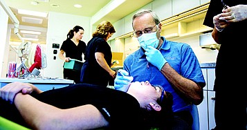 &lt;p&gt;Dr. Thomas Jaeger checks up on his assistant, Sammy Findley&Otilde;s braces Tuesday morning after providing orthodontic services to students of Woodland Middle School in Jaeger&Otilde;s mobile clinic.&lt;/p&gt;