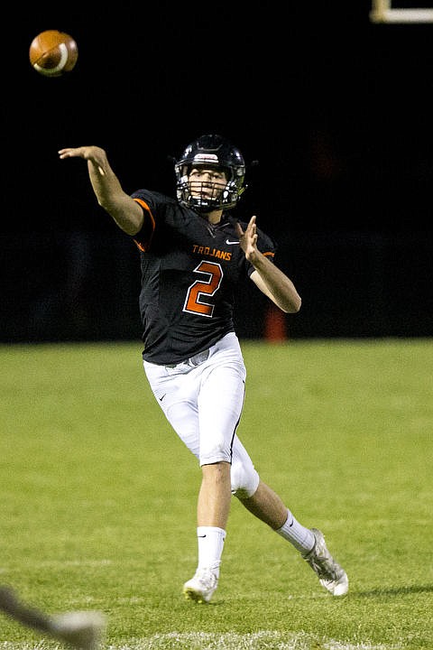<p>JAKE PARRISH/Press Post Falls junior quarterback Nate Buer launches a pass to the endzone during the second quarter of a match-up with University on Friday at Post Falls High School.</p>