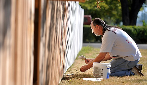 &lt;p&gt;Bob Morris puts a layer of primer on a fence around his yard on
Monday in Kalispell. Morris said he built the fence last summer is
taking advantage of the warm weather to paint and protect the fence
this year before the snow comes again.&lt;/p&gt;