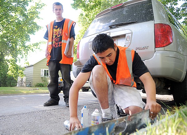 &lt;p&gt;Mike Thomas, 16, of Kalispell, paints a house number onto the
curb Sept. 2 in Kalispell. In the background is Zack Ferron, 16, of
Kalispell. The teens are part of the Kalispell/Columbia Falls Youth
Project.&lt;/p&gt;