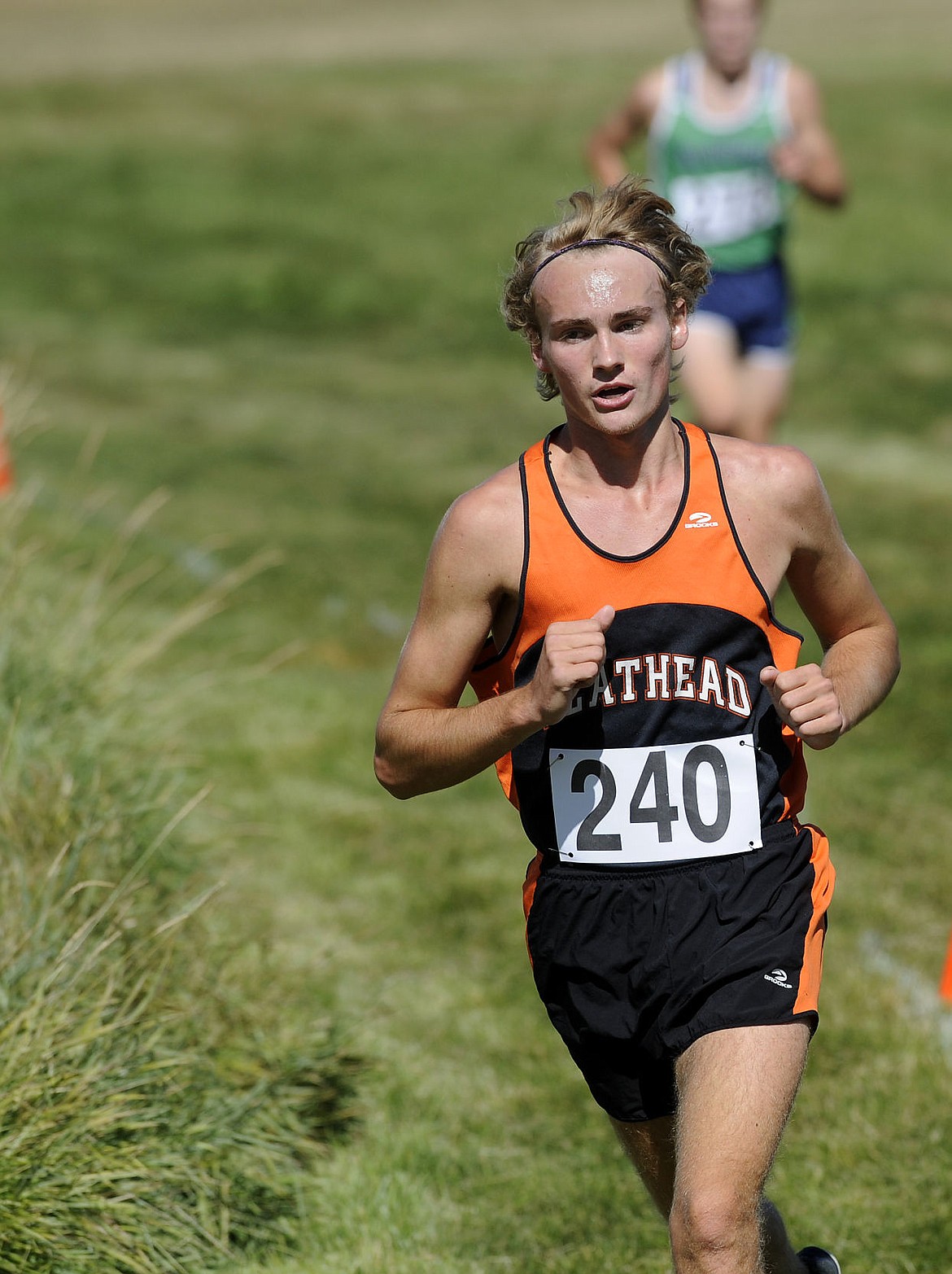 &lt;p&gt;Flathead's Jake Perrin rounds a corner during the final lap of the Flathead Invite at Rebecca Farm. Perrin finished in sixth with a time of 16:21. (Aaric Bryan/Daily Inter Lake)&lt;/p&gt;