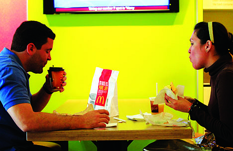 &lt;p&gt;Carlos Gonzalez and Elsa Guzman eat breakfast at a McDonald's restaurant, Wednesday, Sept. 12, 2012 in New York. McDonald's restaurants across the country will soon get a new menu addition: The number of calories in the chain's burgers and fries. The world's biggest hamburger chain said Wednesday that it will post calorie information on restaurant and drive-thru menus nationwide starting Monday. The move comes ahead of a regulation that could require major chains to post the information as early as next year. &quot;It's good to know the calories I'm consuming so I can plan out my whole day,&quot; said Gonzalez. (AP Photo/Mark Lennihan)&lt;/p&gt;