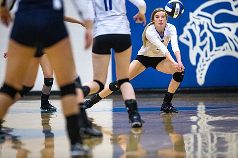 &lt;p&gt;Missy Huddleston, a player for the Coeur d'Alene High School volleyball team, bumps the ball as the Vikings took on the Lake City Timberwolves Thursday night.&lt;/p&gt;