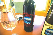 Monster Red, a blend of merlot and cabernet, is one of 21 varieties of wine Tom Campbell produces at Mission Moutain Winery in Dayton. The winery is the state's oldest and Campbell has won awards every year for his wines.