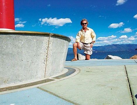 Sandpoint Parks and Recreation Director Kim Woodruff shows off the sitting area at the end of jetty in the recently-renovated Windbag Park in this 2012. This section of the project was made possible by a donation from the Chris and Genevive Campbell family.