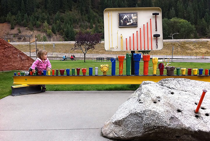 &lt;p&gt;Johanna Dickert, 2, plays near a display for mining display where a clean-up and restoration project at the site of the Wallace railway yard is currently taking place. As each section of the site is completed, the area is transformed into a public use area.&lt;/p&gt;