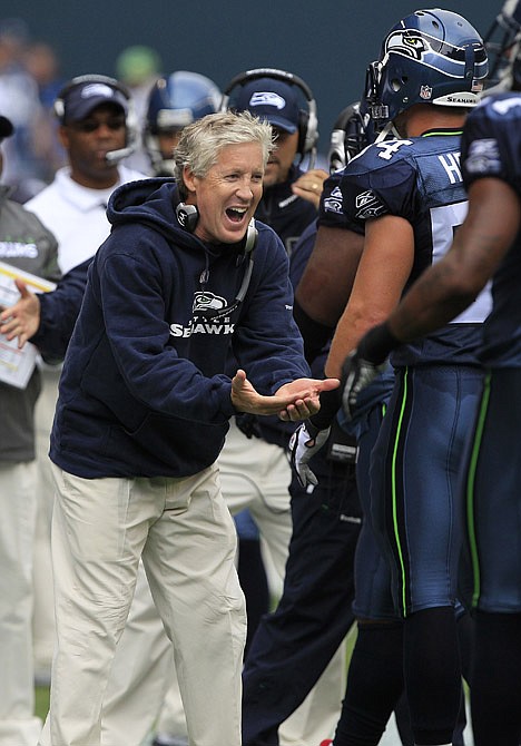 &lt;p&gt;Seattle Seahawks coach Pete Carroll congratulates his defense for holding the San Francisco 49ers on fourth and 1 in the first half Sunday in Seattle.&lt;/p&gt;