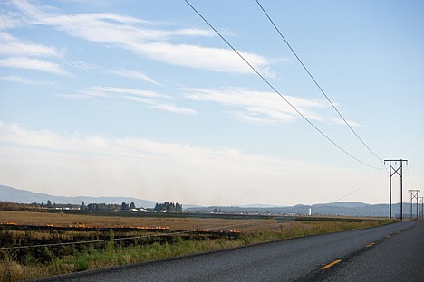 &lt;p&gt;An Avista Utilities power line lies in a farm field as a 2-acre fire burns nearby.&lt;/p&gt;