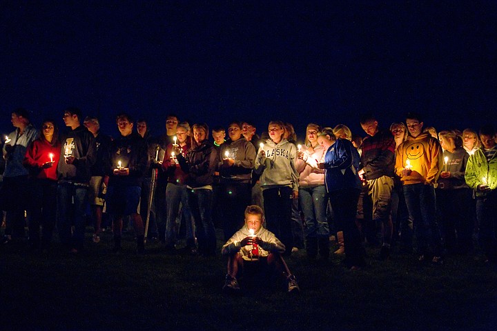 &lt;p&gt;Classmates, friends and family gather on a grassy hillside between the Coeur d'Alene High School baseball and football fields Monday to remember Devon Austin and Ryan Reinhardt who were killed in a car wreck early Sunday near Twin Falls.&lt;/p&gt;