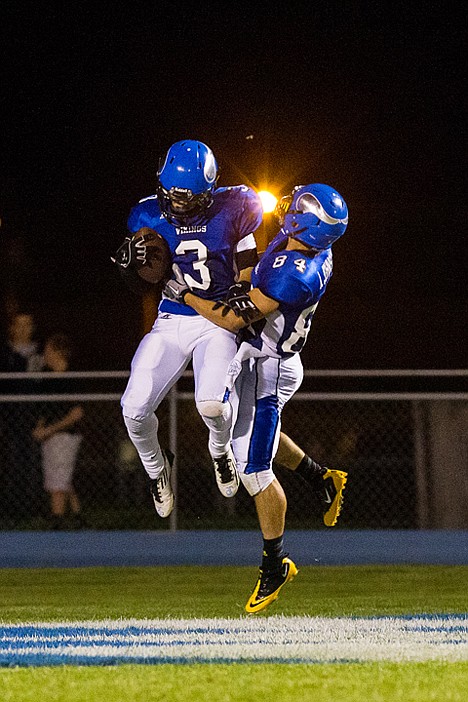 <p>The Vikings' Jonny Plum celebrates with teammate Addison Johnson after a second quarter run for a touchdown.</p>