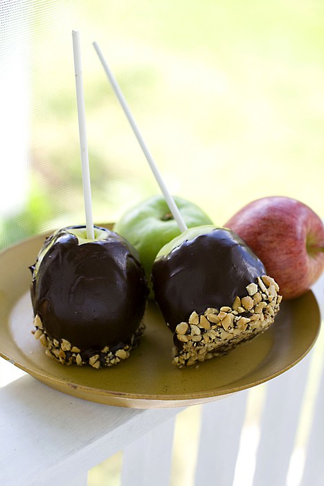 &lt;p&gt;This Aug. 22, 2011 photo shows chocolate peanut butter covered apples in Concord, N.H. With the onset of apple season, it?s time to start thinking about ways to use up all those bushels you bring home from your picking adventures. (AP Photo/Matthew Mead)&lt;/p&gt;