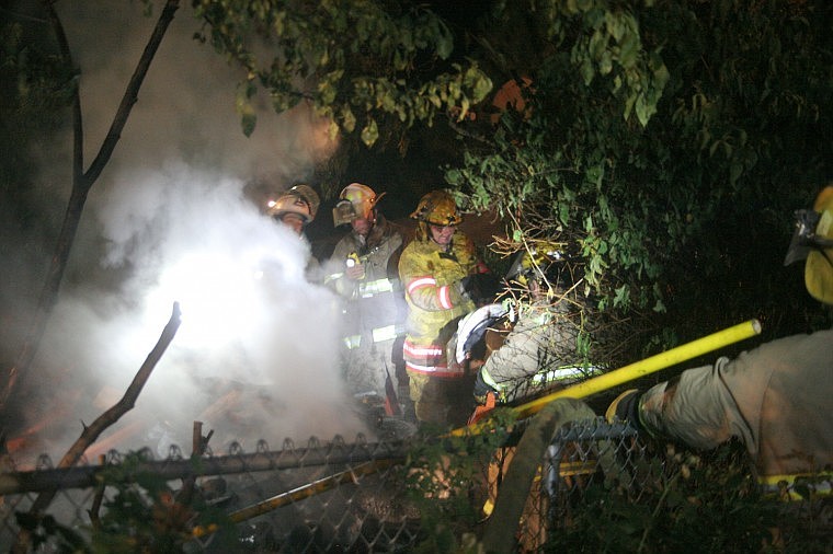 &lt;p&gt;Firefighters go through and soak each piece of wood after putting out the wood heater fire Sept. 14. The fire consumed the whole heater structure, and no one was injured.&lt;/p&gt;