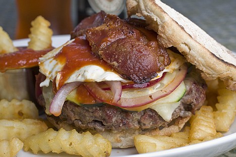 &lt;p&gt;This Aug. 30, 2010 photo shows the Lola Burger from Food Network Iron Chef Michael Symon. Symon offered up his Lola burger, a super-moist burger made from three grinds of beef and topped with pickled red onions, cheddar cheese and his own spicy ketchup _ all nestled in a toasted English muffin for AP's 20 Burgers of Summer series.&lt;/p&gt;