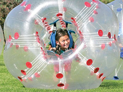 &lt;p&gt;Zorb ball fun at Roosevelt Park Saturday with Trenity Stafford.&lt;/p&gt;