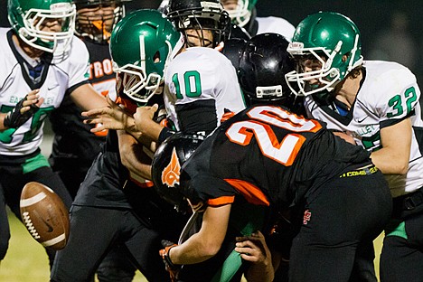 &lt;p&gt;Post Falls High School's Nate Gomer (20) pops the ball out of the hands of East Valley quarterback Taylor Watkins (10) Friday causing a third quarter turnover.&lt;/p&gt;