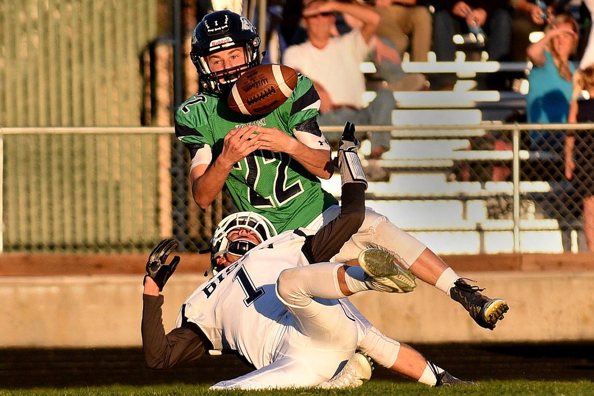 &lt;p&gt;Glacier receiver Scout Willcut can't come down with the ball after wrestling it away from Bison defender Kody Torgeson on a long pass attempt in the first quarter at Legends Stadium on Friday. (Aaric Bryan/Daily Inter Lake)&lt;/p&gt;