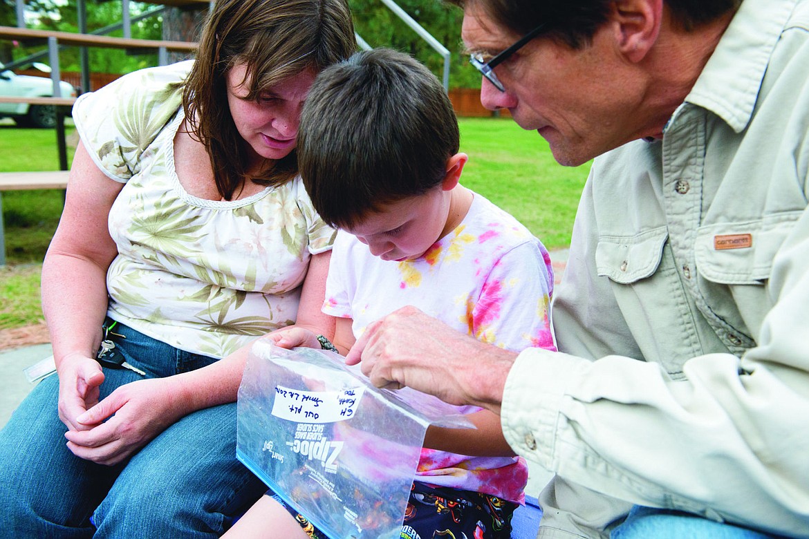 &lt;p&gt;From left to right, Ms. Segura, Fletcher Segura, and Doug Ferrell looks at owl regurgitation.&#160;&lt;/p&gt;